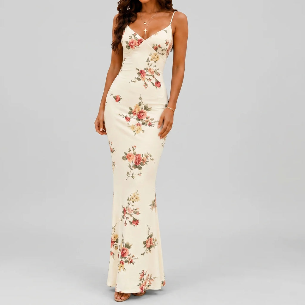 Front view of white floral maxi dress with spaghetti straps and bodycon fit by BELLA HUDSON