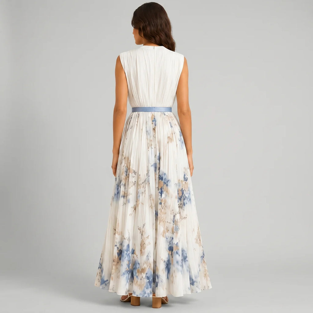 Back view of white floral V-neck maxi dress with sleeveless design and flowy silhouette by BELLA HUDSON