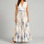 Front view of white floral V-neck maxi dress with sleeveless design and flowy silhouette by BELLA HUDSON