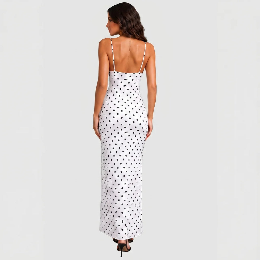 Back view of white polka dot maxi dress with black lace trim and spaghetti straps by BELLA HUDSON