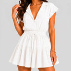 Front view of white tiered romper with drawstring waist and cap sleeves by BELLA HUDSON
