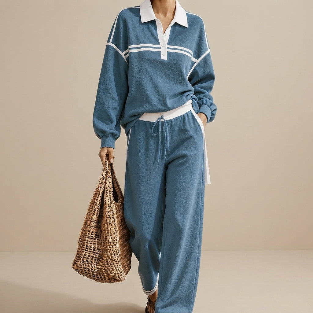 Front view of the Wilhelmina Two-Piece Set Striped Polo Wide-Leg in Blue, featuring a striped polo top and relaxed wide-leg pants.