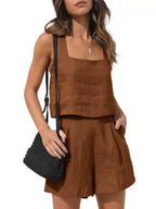 Front view of the Wilhelmina Two-Piece Set Tank Shorts in dark brown, featuring a sleeveless square-neck tank top with button details and matching high-waisted shorts. Designed by Charlier Paris.