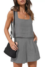 Front view of the Wilhelmina Two-Piece Set Tank Shorts in gray, featuring a sleeveless square-neck tank top with button details and matching relaxed-fit shorts. Designed by Charlier Paris.
