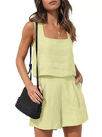 Front view of the Wilhelmina Two-Piece Set Tank Shorts in light green, featuring a sleeveless square-neck tank top with button details and matching relaxed shorts. Designed by Charlier Paris.