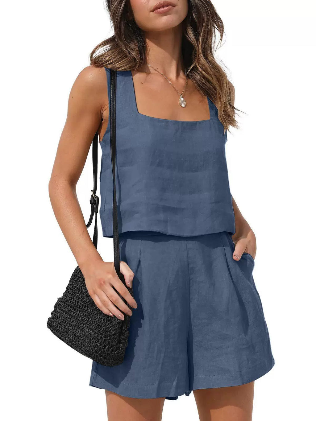 Front view of the Wilhelmina Two-Piece Set Tank Shorts in navy blue, featuring a sleeveless square-neck tank top with button details and matching high-waisted shorts. Designed by Charlier Paris.