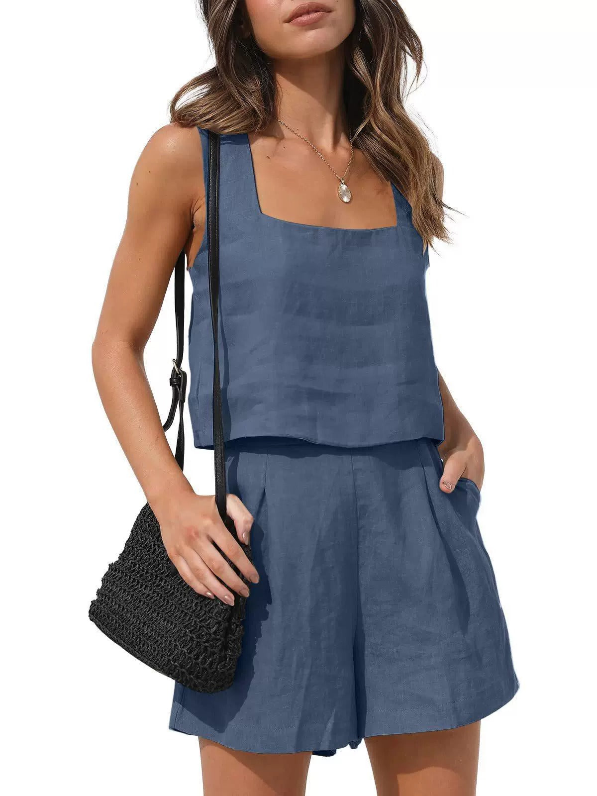 Front view of the Wilhelmina Two-Piece Set Tank Shorts in navy blue, featuring a sleeveless square-neck tank top with button details and matching high-waisted shorts. Designed by Charlier Paris.
