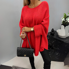Front view of the Wilhelmine Sweater Oversized Batwing-Sleeve in red, featuring a round neckline, wide batwing sleeves, textured knit fabric, asymmetrical hem, and a relaxed oversized silhouette. Designed by Bella Hudson.