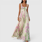 Front view of the Winnie Maxi Cocktail Dress Floral-Print Chiffon Square-Neck in white, featuring a square neckline, sleeveless bodice, flowing chiffon skirt, and elegant floral print. Designed by Bella Hudson.