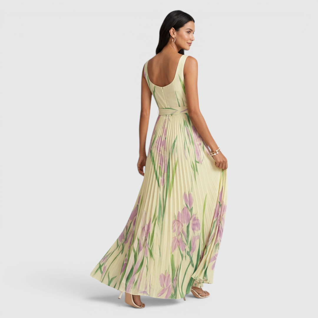 Back view of the Winnie Maxi Cocktail Dress Floral-Print Chiffon Square-Neck in yellow, highlighting the sleeveless design, flowing chiffon fabric, and graceful floral-print maxi silhouette. Designed by Bella Hudson.