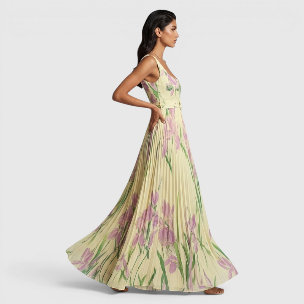 Side view of the Winnie Maxi Cocktail Dress Floral-Print Chiffon Square-Neck in yellow, showcasing the sleeveless square neckline, flowing chiffon skirt, and elegant floral-print silhouette. Designed by Bella Hudson.