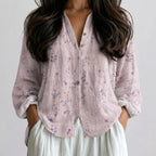 Close-up front view of light pink floral boho lightweight blouse with button front and long sleeves BELLA HUDSON.

