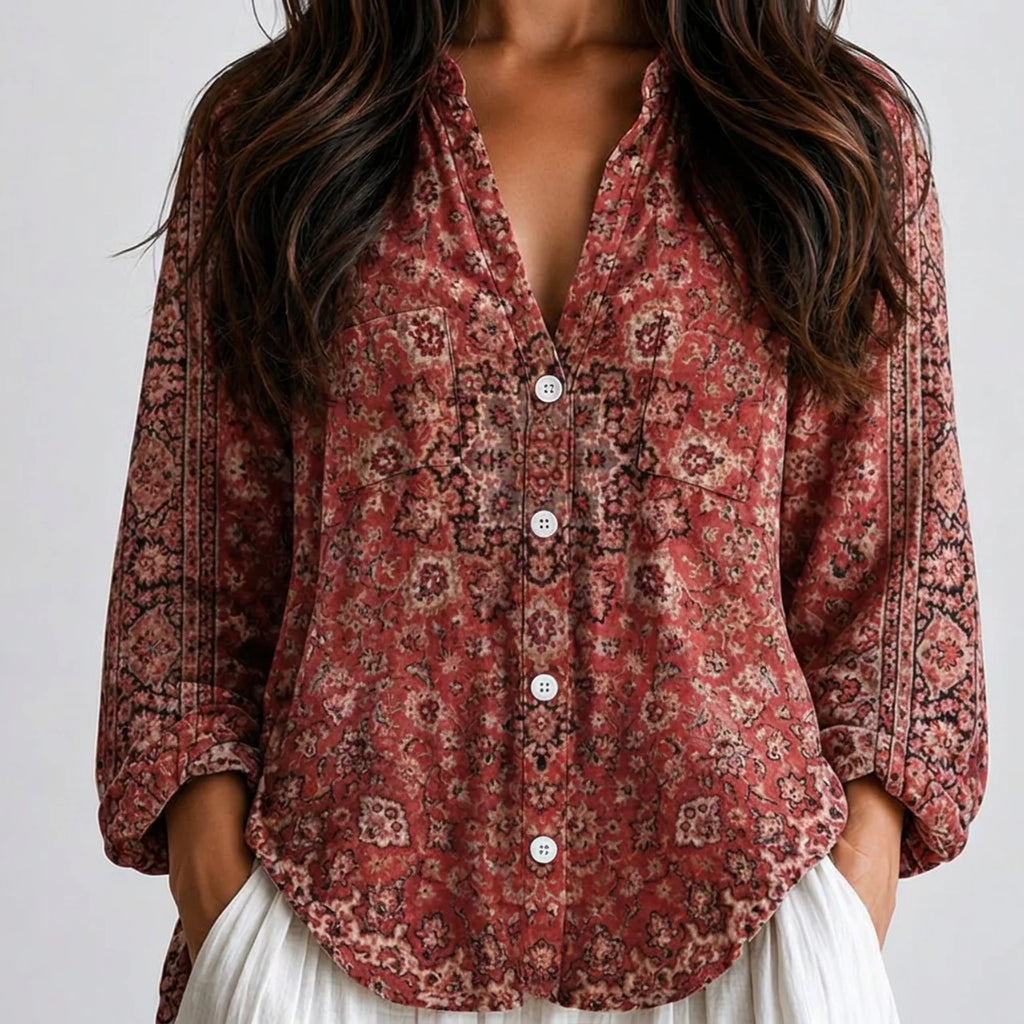 Close-up front view of red patterned floral boho lightweight blouse with button front and long sleeves BELLA HUDSON.
