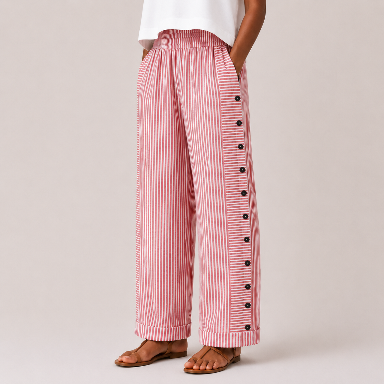 Red front view of Woman's Lightweight Pants with Button Design featuring striped fabric, side button accents, and a relaxed wide-leg fit, designed by Bella Hudson