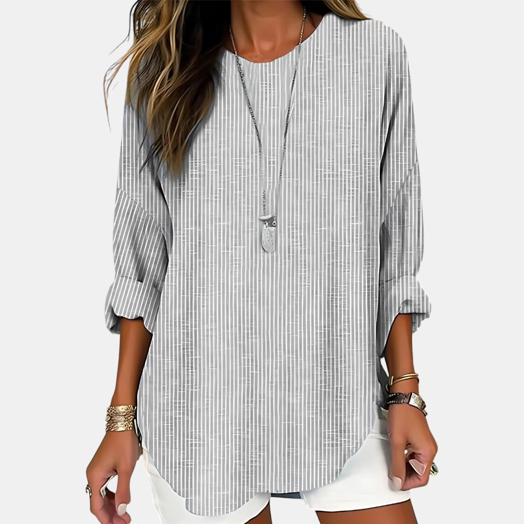 Front view of the Women's Boho Lightweight Blouse in gray, featuring a loose oversized silhouette, round neckline, rolled sleeves, textured fabric, and a flattering high-low hem. Designed by Bella Hudson.
