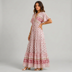 Side view of pink Womens Boho Paisley Print Maxi Dress with Tassel Details by BELLA HUDSON
