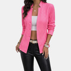 Close-up detail of the Women's Chic Blazer in pink, featuring the notched lapel, button-front closure, flap pockets, and tailored construction. Designed by Bella Hudson.