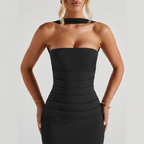 Close-up detail of the Women's Cocktail Maxi Dress Bodycon Fit with Styled Scarf in black, featuring the strapless neckline, structured bodice, and flattering bodycon fit. Designed by Bella Hudson.