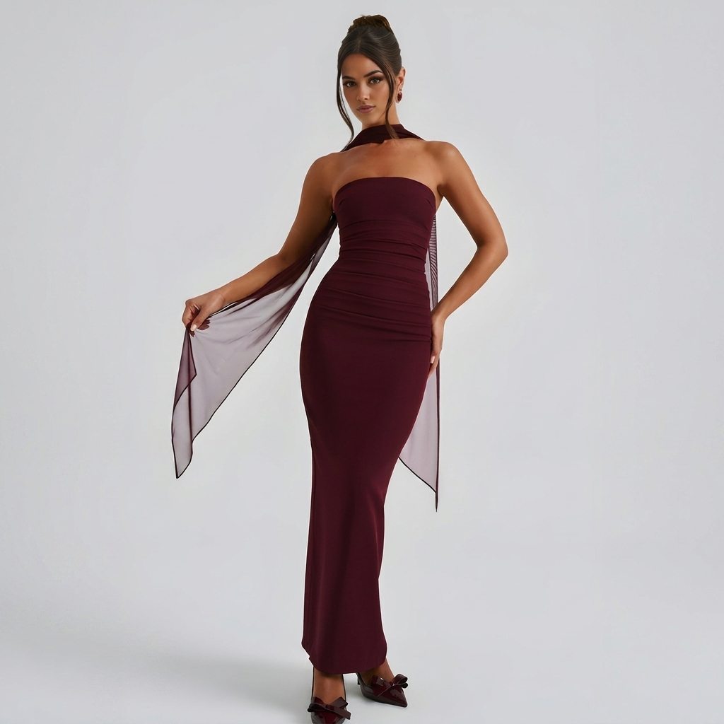 Front view of the Women's Cocktail Maxi Dress Bodycon Fit with Styled Scarf in burgundy, featuring a strapless neckline, figure-hugging silhouette, sheer scarf accent, and elegant floor-length styling. Designed by Bella Hudson.