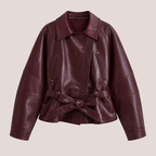 Front view of Women's Cropped Biker Style Faux Leather Jacket in wine red featuring an oversized silhouette, wide collar, belted waist, and premium faux leather finish designed by Bella Hudson.