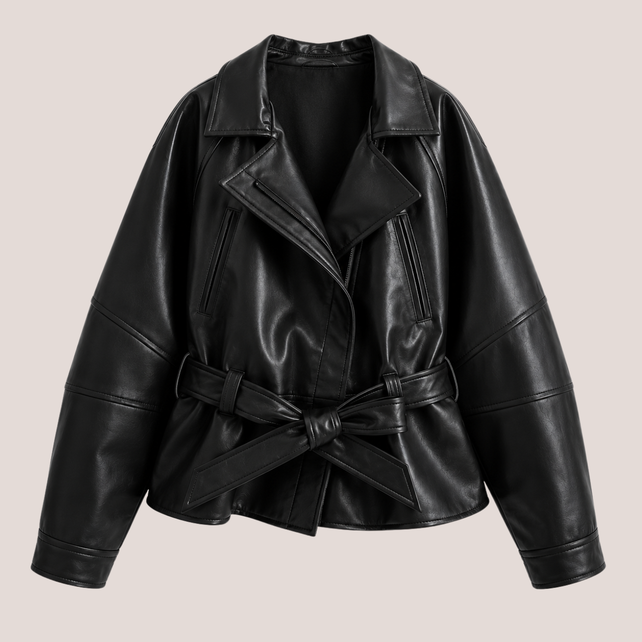product view of Women's Cropped Biker Style Faux Leather Jacket in wine red highlighting the oversized collar, faux leather texture, stitching details, and waist belt designed by Bella Hudson.