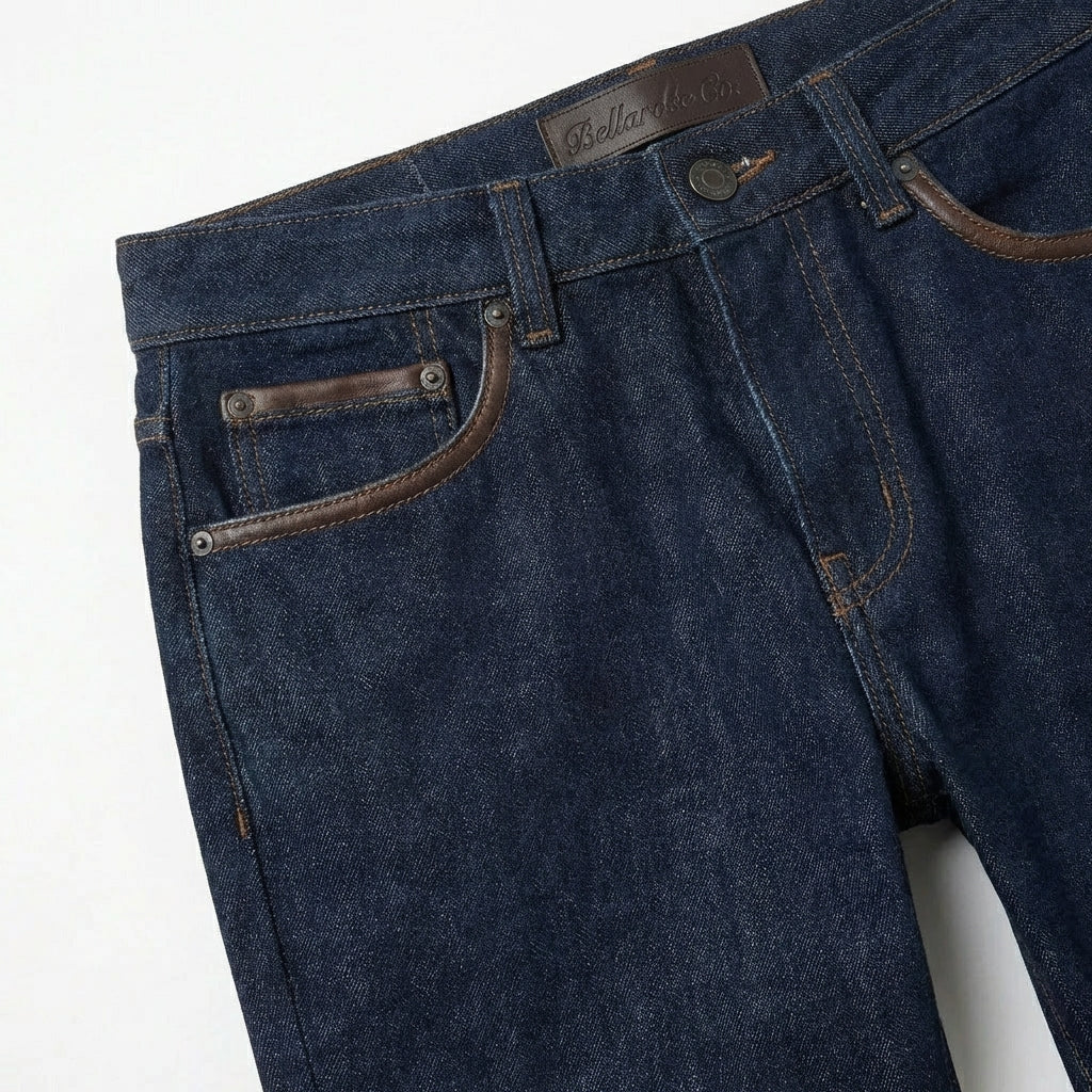 Close-up of dark blue denim jeans with pocket detail and stitching BELLA HUDSON