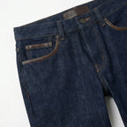 Close-up of dark blue denim jeans with pocket detail and stitching BELLA HUDSON