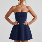 Close-up detail of the Women's Mini Dress Strapless Flared Skirt in navy blue, featuring the strapless neckline, structured bodice, and flattering fitted waist. Designed by Bella Hudson.