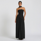 Front view of the Women's Wedding Guest Maxi Dress with a strapless bodice and high-split design in black, showcasing a fitted bodice, elegant draping, and a flowing floor-length silhouette with a high side slit. Designed by Bella Hudson.