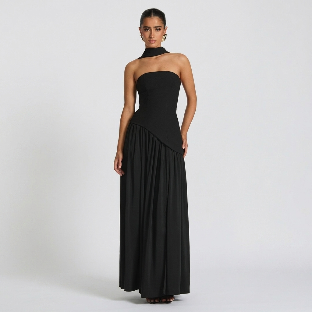 Front view of the Women's Wedding Guest Maxi Dress with a strapless bodice and high-split design in black, showcasing a fitted bodice, elegant draping, and a flowing floor-length silhouette with a high side slit. Designed by Bella Hudson.