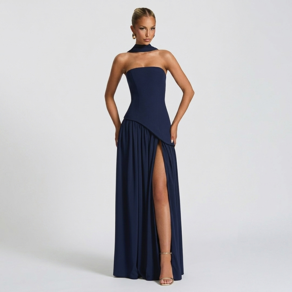 Front view of the Women's Wedding Guest Maxi Dress with a strapless bodice and high-split design in dark blue, featuring a structured strapless bodice, gathered waist, and graceful maxi skirt with a statement slit. Designed by Bella Hudson.