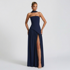 Front view of the Women's Wedding Guest Maxi Dress with a strapless bodice and high-split design in dark blue, featuring a structured strapless bodice, gathered waist, and graceful maxi skirt with a statement slit. Designed by Bella Hudson.