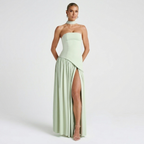 Front view of the Women's Wedding Guest Maxi Dress with a strapless bodice and high-split design in light green, featuring a fitted bandeau bodice, flowing maxi skirt, and dramatic side slit with an elegant silhouette. Designed by Bella Hudson.