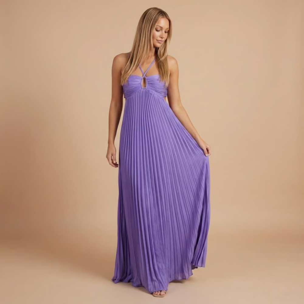 Front view of the Women's Wedding Guest Maxi Dress with a strapless bodice and high-split design in purple, featuring a softly pleated maxi skirt, ruched sweetheart neckline, and elegant flowing silhouette. Designed by Bella Hudson.