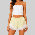 Front view of yellow A lace trim bloomer shorts with elastic waist and layered ruffle design by BELLA HUDSON