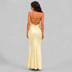 Back view of yellow satin maxi dress with spaghetti straps and bodycon silhouette by BELLA HUDSON