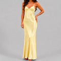 Front view of yellow satin maxi dress with spaghetti straps and bodycon silhouette by BELLA HUDSON
