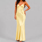 Front view of yellow satin maxi dress with spaghetti straps and bodycon silhouette by BELLA HUDSON