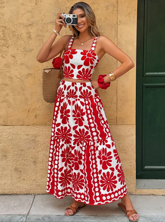 Front pose view of the Yolanda Jumpsuit Maxi Dress Retro-Print Sleeveless Wide-Leg in red and white, showcasing the thin straps, fitted bodice, defined waist, retro floral print, and wide-leg silhouette. Designed by Charlier Paris.