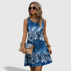 Front view of the Zinnia A-Line Dress Sleeveless Ink-Wash-Print in dark blue, featuring a sleeveless round neckline, ink-wash print, and a relaxed A-line silhouette. Designed by Bella Hudson.