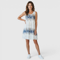 Front view of the Zinnia A-Line Dress Sleeveless Ink-Wash-Print in white, featuring a sleeveless round neckline, blue ink-wash print, relaxed A-line silhouette, and a lightweight above-the-knee design. Designed by Bella Hudson.