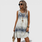 Lifestyle view of the Zinnia A-Line Dress Sleeveless Ink-Wash-Print in white, showcasing the relaxed A-line silhouette, lightweight fabric, and modern ink-wash print. Designed by Bella Hudson.