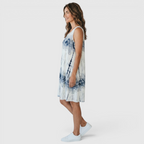 Side view of the Zinnia A-Line Dress Sleeveless Ink-Wash-Print in white, showcasing the sleeveless cut, relaxed A-line silhouette, and artistic blue ink-wash print. Designed by Bella Hudson.